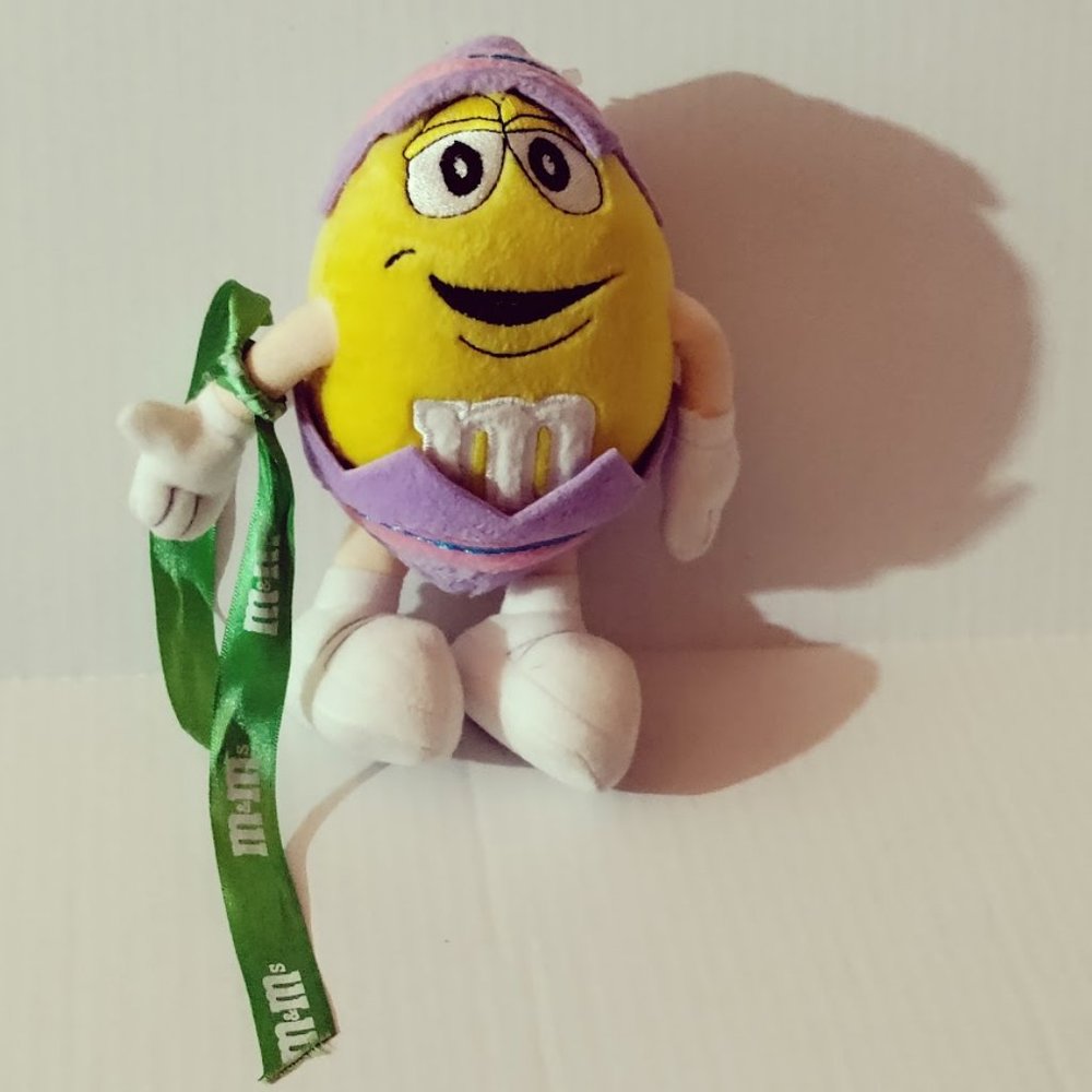 M & M 2001 Yellow Plush in Easter Egg Costume with bendable arms and legs